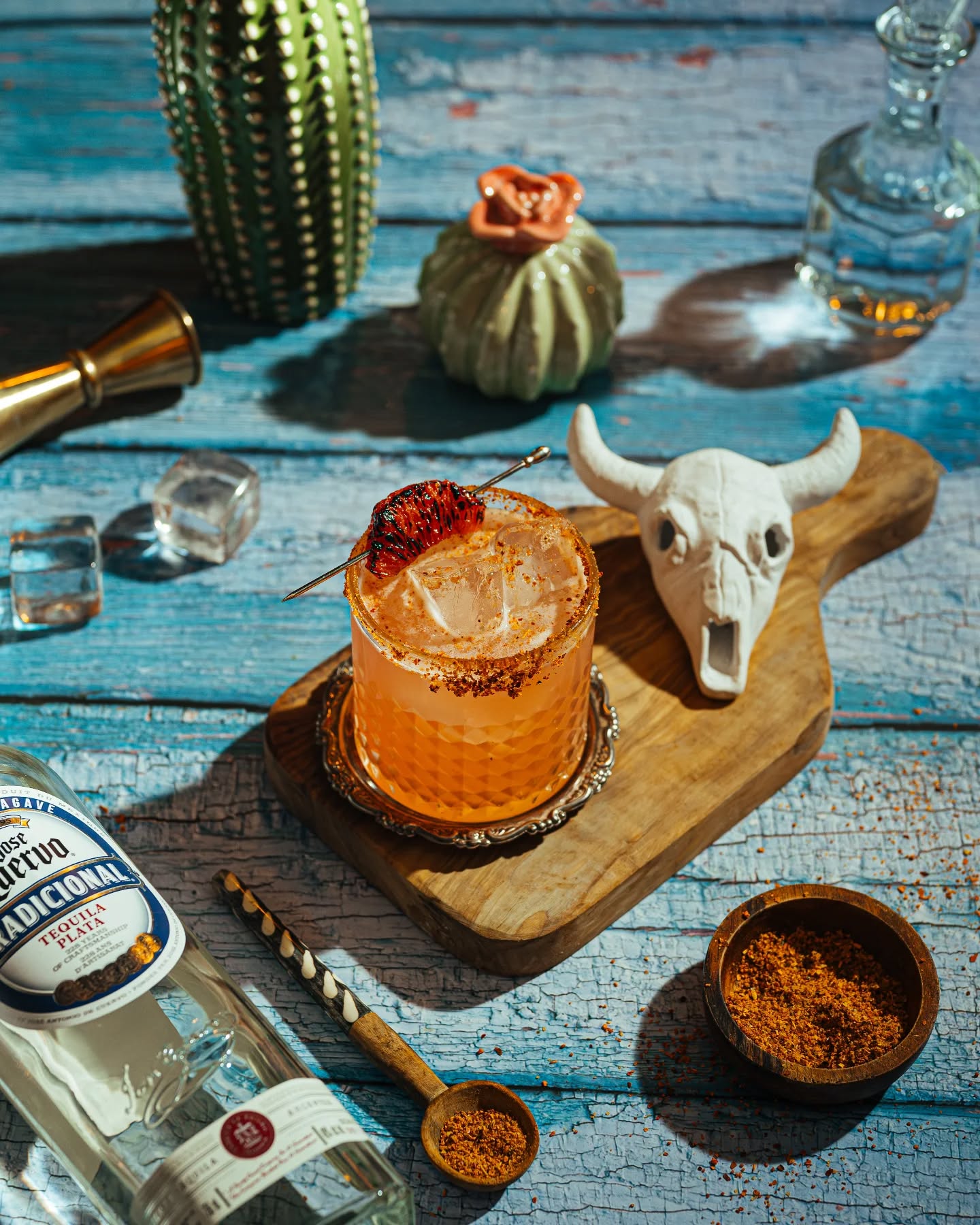 Spiced tequila cocktail styled with a desert-themed tablescape