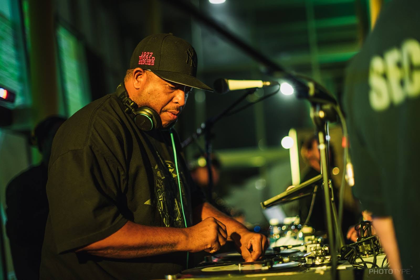 DJ performing at a live event, photographed by Phototype