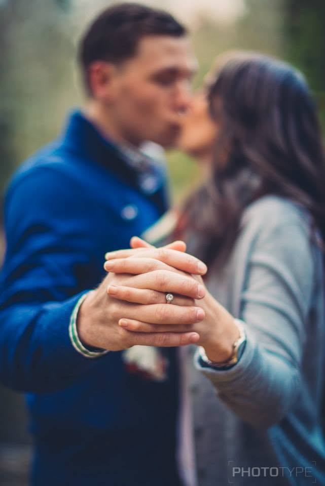 Engagement portrait of a couple holding hands, photographed by Phototype